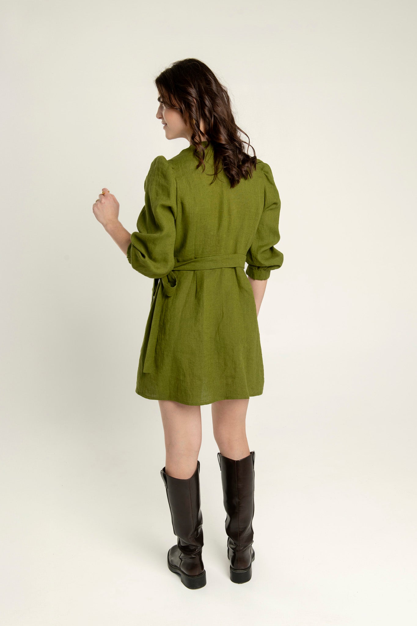 Madeleine crossover linen mini dress with pockets and slightly flared skirt.