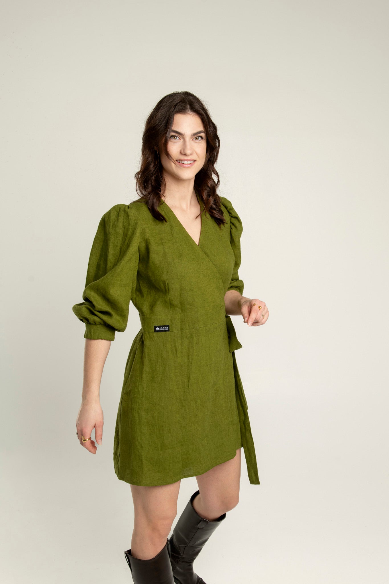 Madeleine crossover linen mini dress with pockets: 3/4 length sleeves and elegant v-neckline.