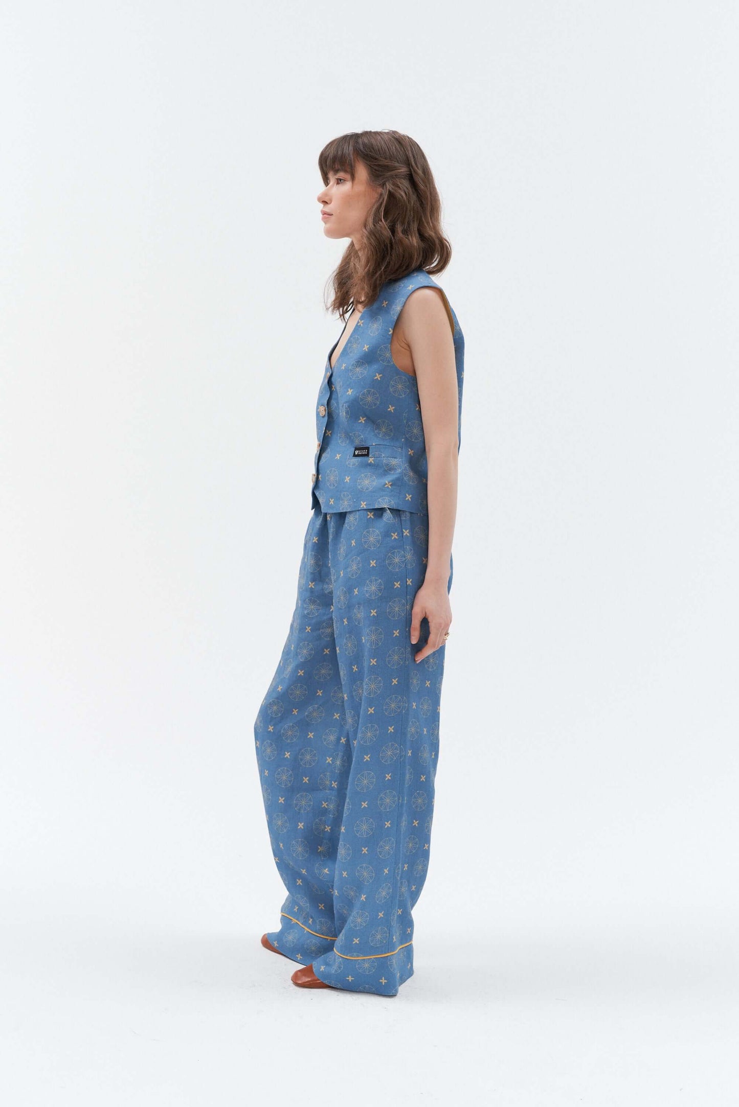 Women’s blue linen waistcoat with a unique star and circle pattern.