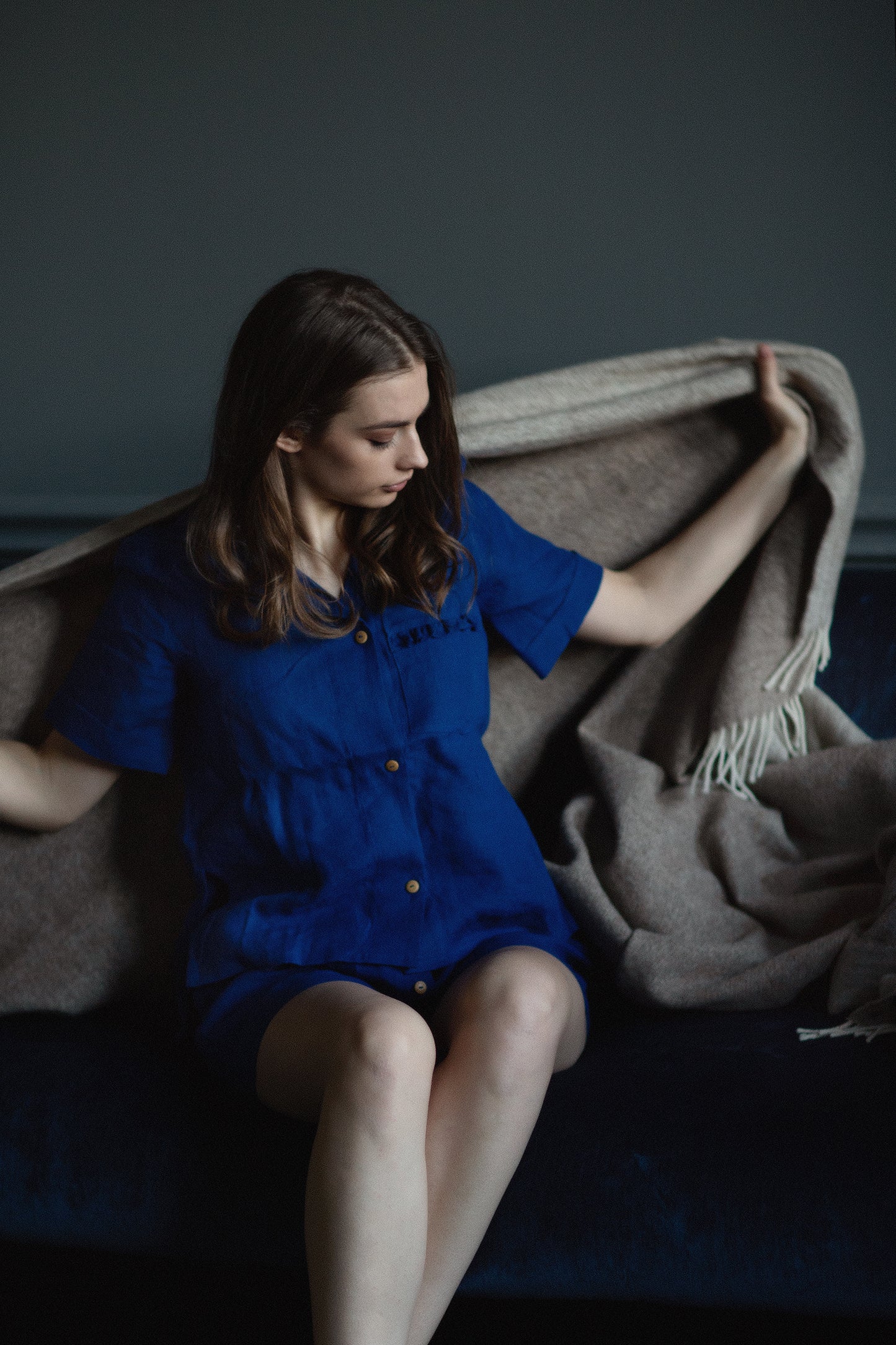 Elegant summer linen outfit for women, featuring ruffled linen top and loose high-waisted linen shorts