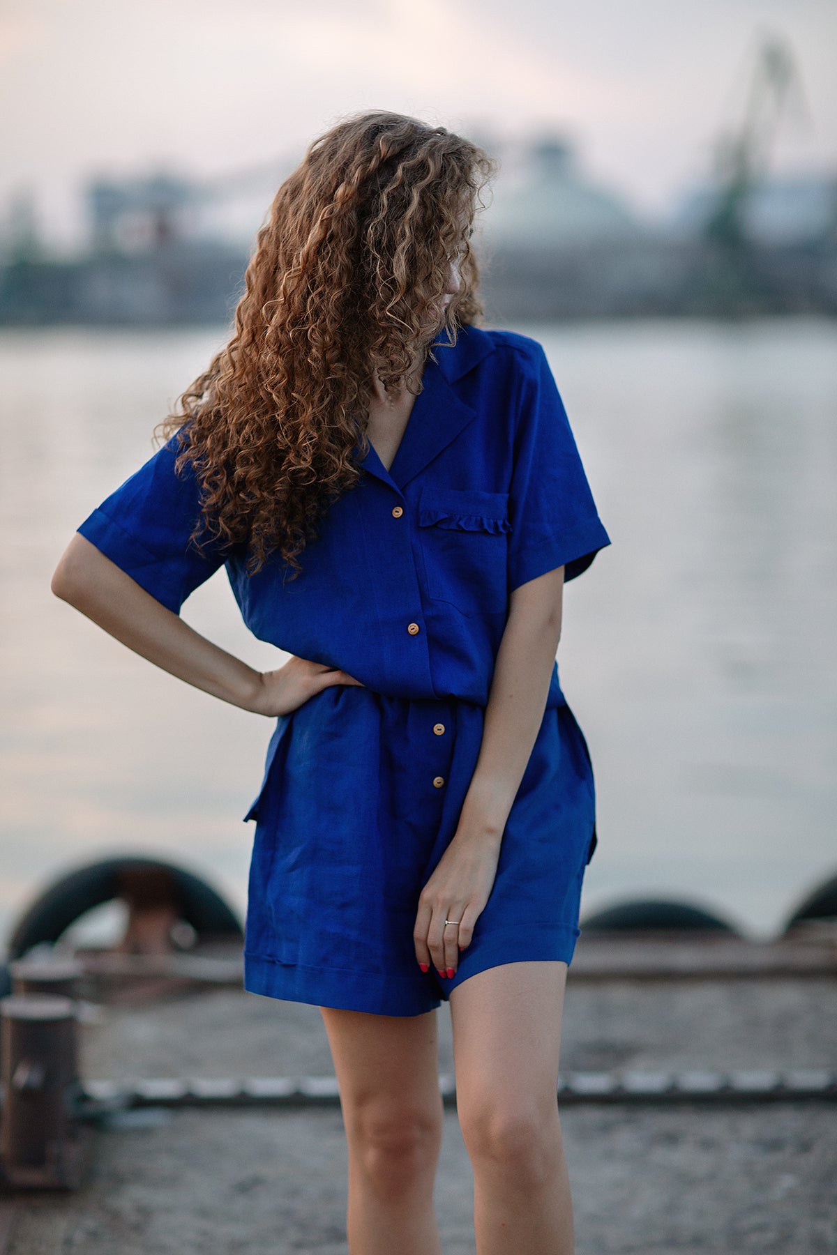 Elegant linen suit for women, featuring a relaxed linen shirt with ruffles and comfortable linen shorts
