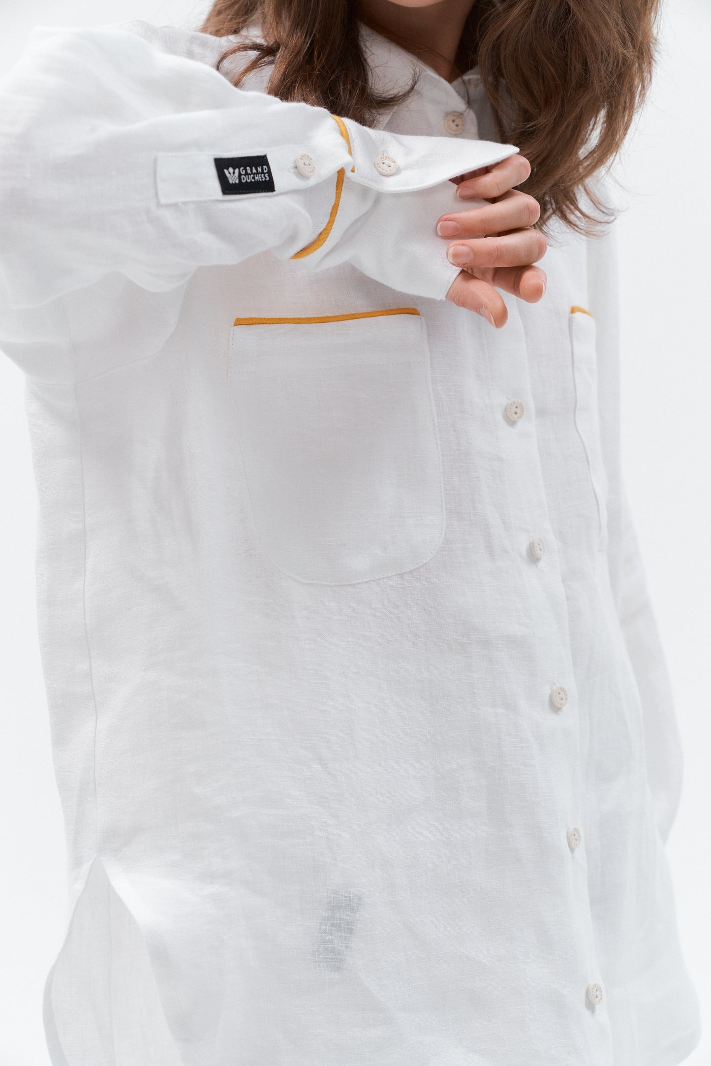 Breathable women’s white linen shirt with elongated back and side slits