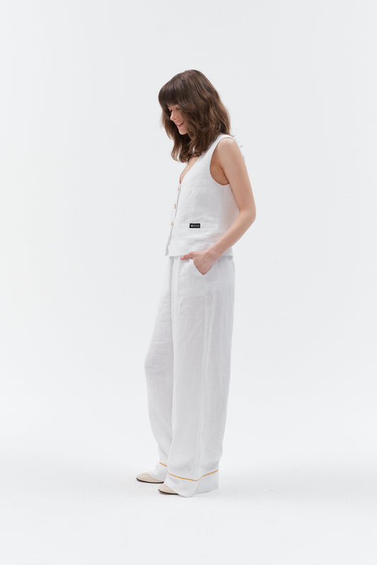 Front side view of women’s white linen wide-leg pants, sleeveless top, casual outfit.