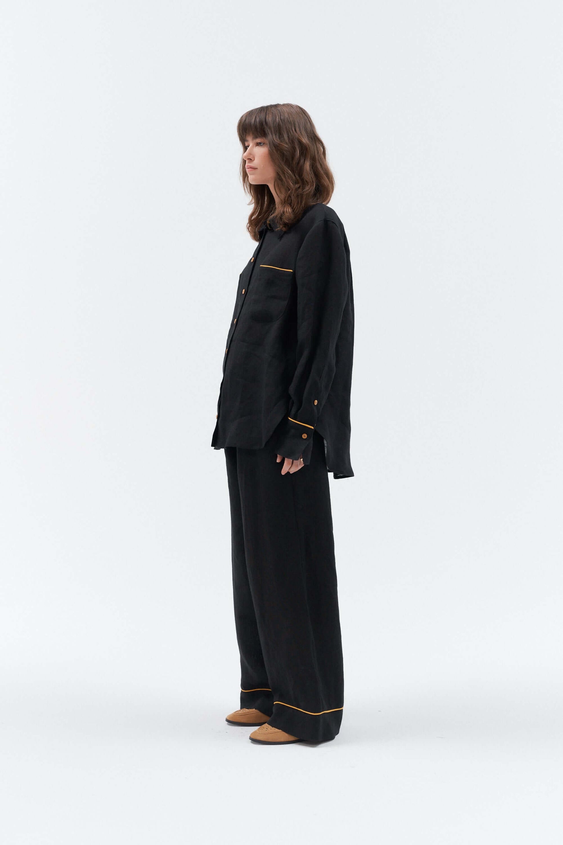 Black women's oversized linen shirt with yellow details.
