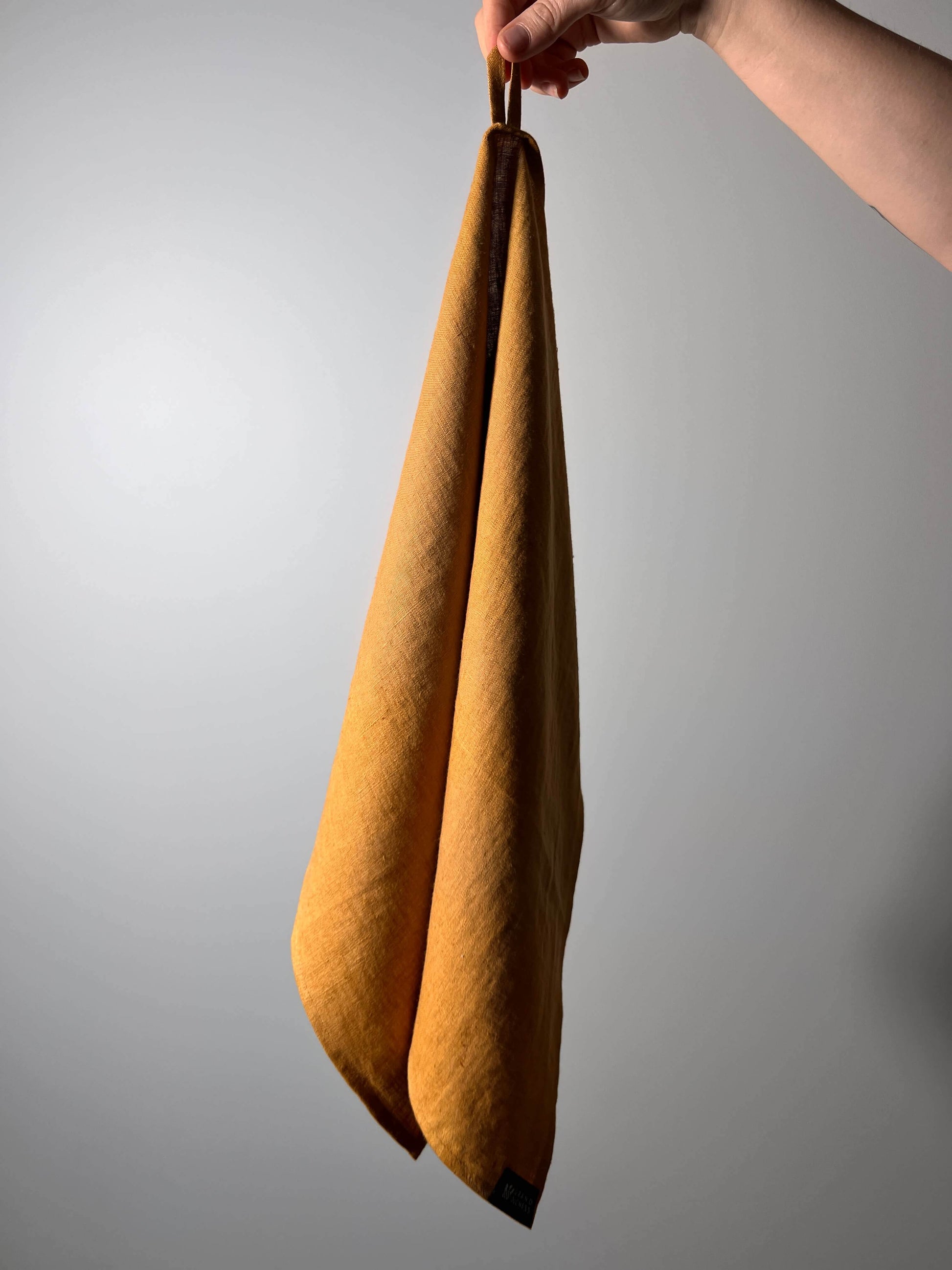 Mustard yellow linen kitchen towel, eco-friendly and absorbent dish towel.