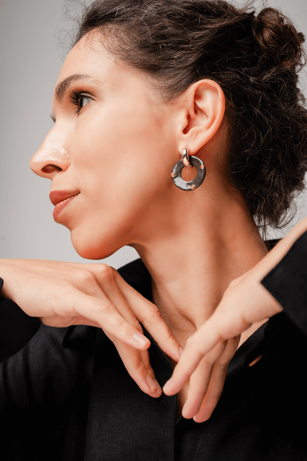 Lightweight hypoallergenic hoop-shaped porcelain earrings with silver clasp and gold accents