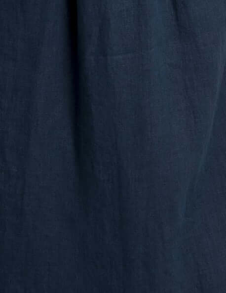 Close-up of a navy linen fabric, showcasing texture and breathability of women's linen waistcoat Vesta.