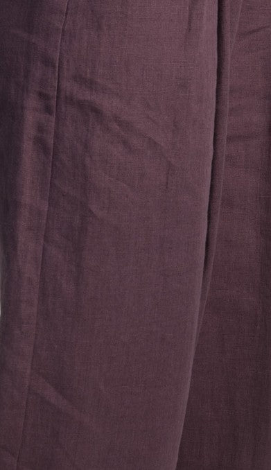 Close-up of plum-colored natural linen fabric, highlighting the texture and breathable quality of the Madison women's linen midi skirt with front slit.