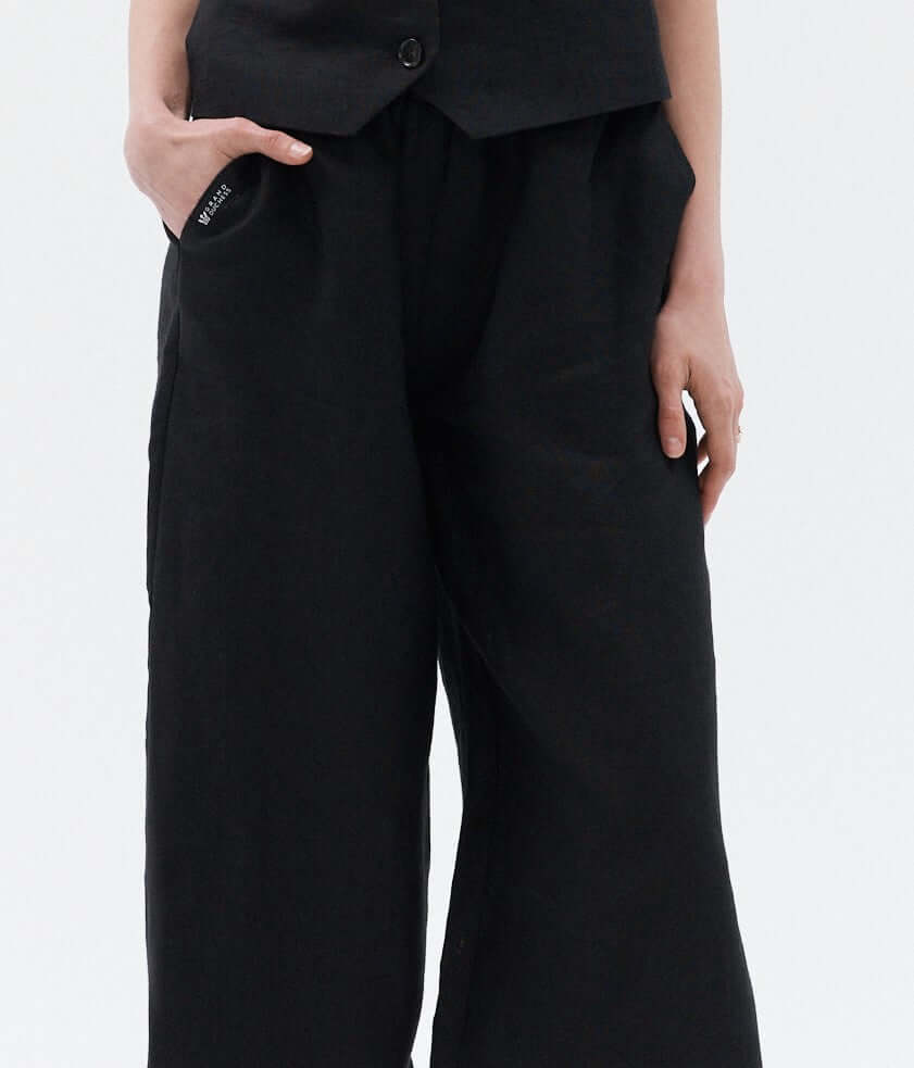 Black women's high-waisted linen pants Independence II, wide-leg sustainable trousers for versatile style.