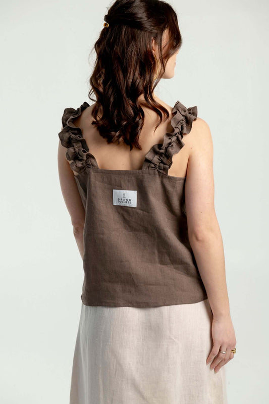 Adventurer II - women's ruffled strap linen top in brown, showcasing ruffled straps and relaxed fit design.