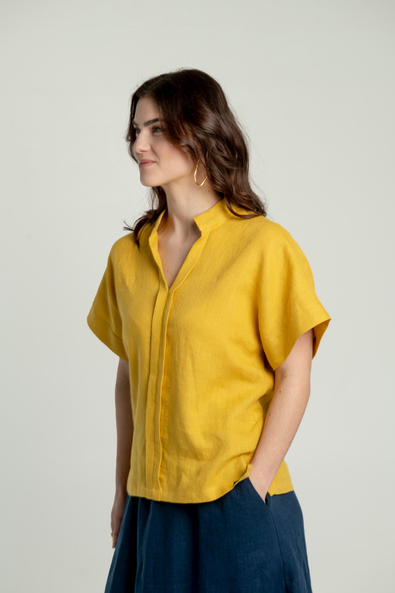 Japanese style linen top in yellow color, showcasing minimalist design and relaxed silhouette.
