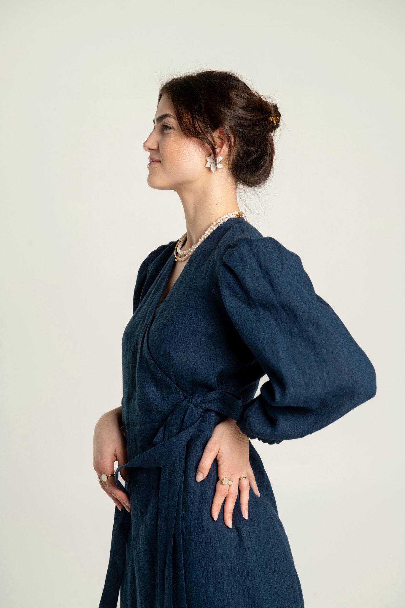 Madeleine crossover linen mini dress with pockets in navy color with adjustable waist.
