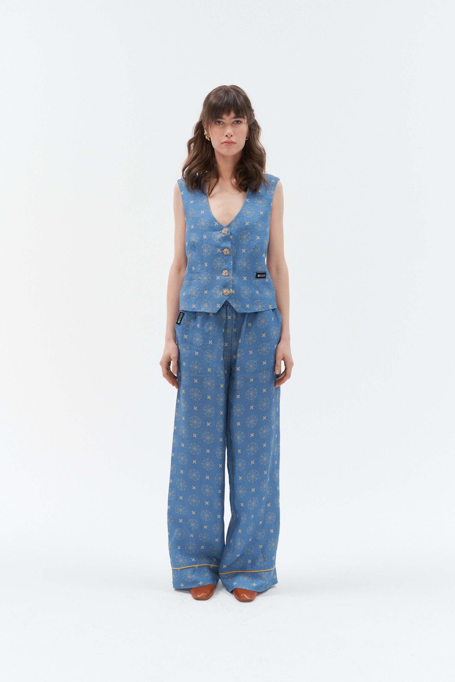 Women’s blue linen waistcoat with a unique star and circle pattern.