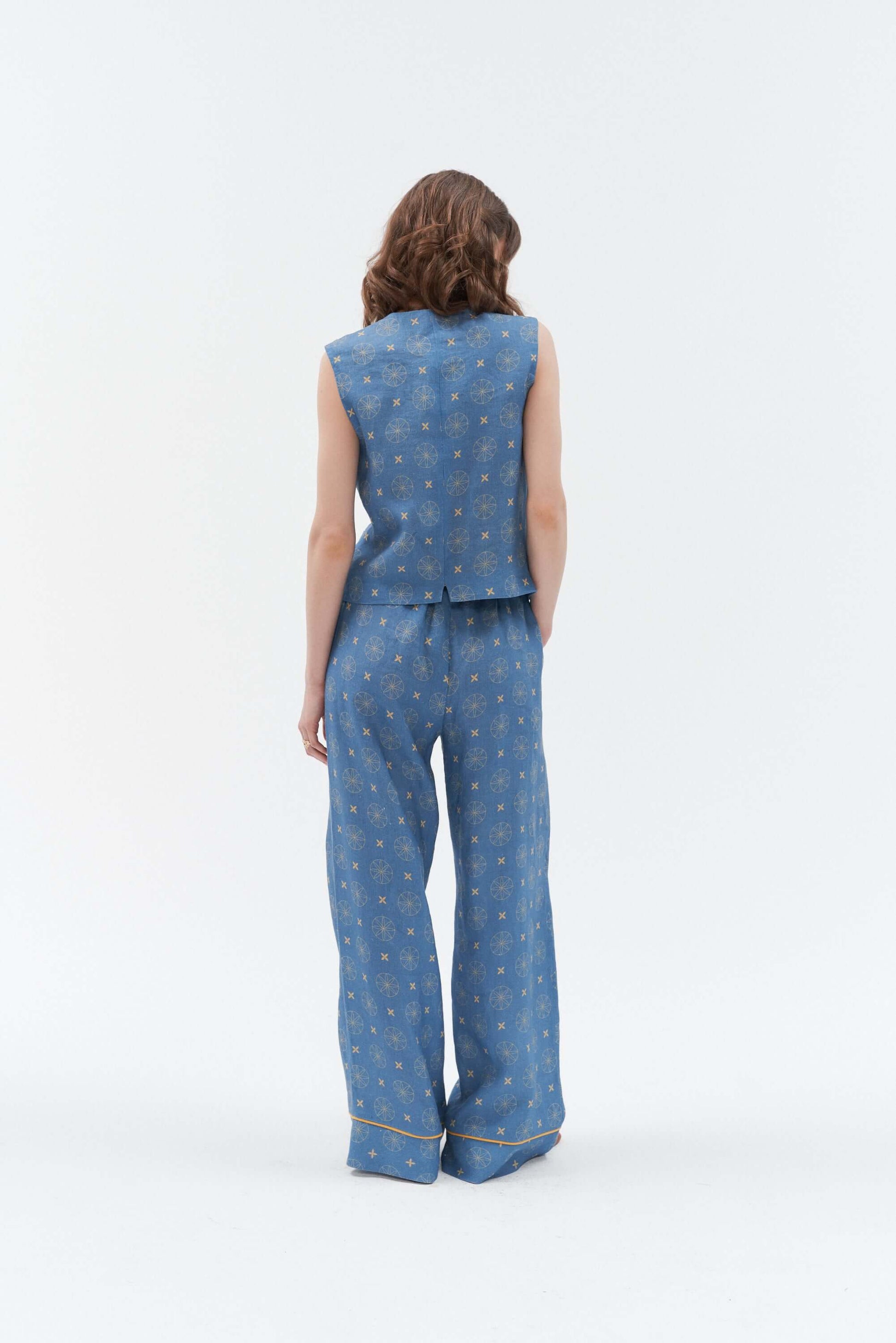 Women’s blue linen waistcoat with a unique star and circle pattern.