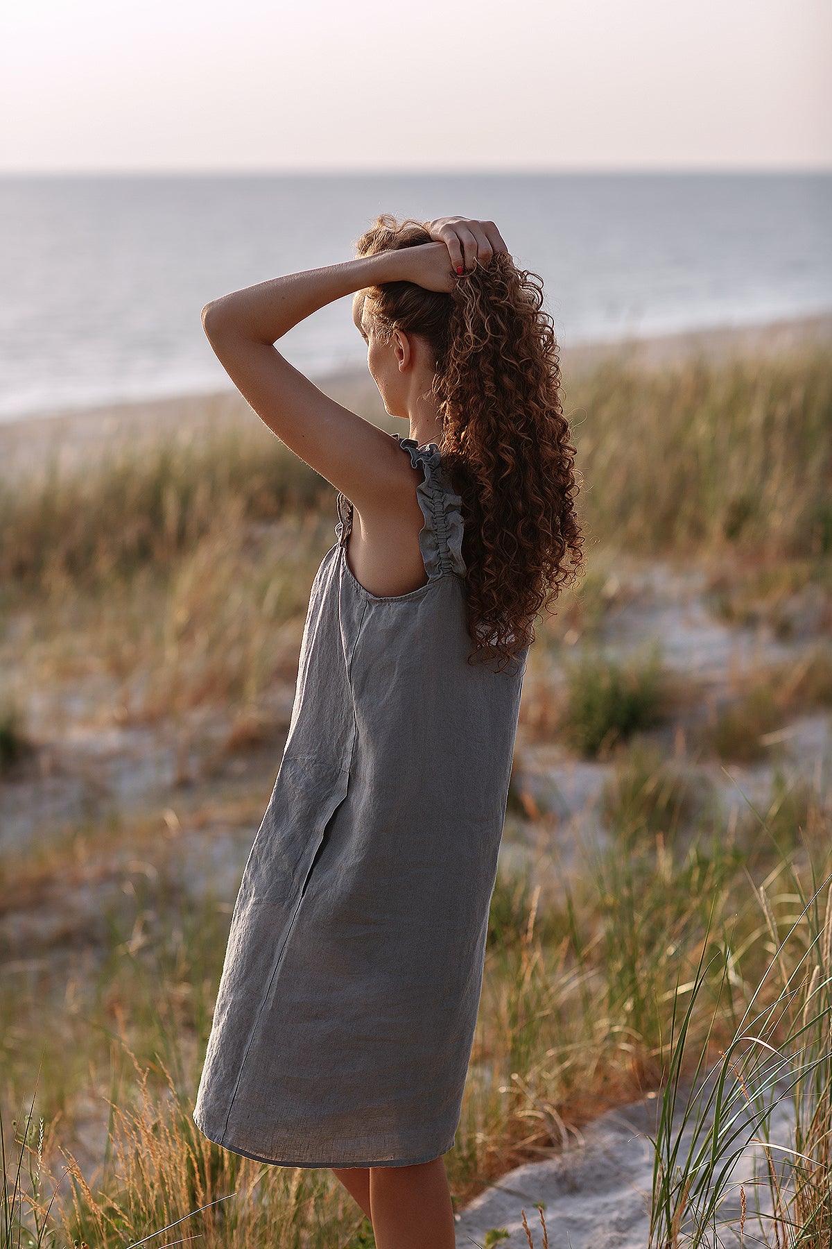 Playful linen dress – ruffled straps and front details