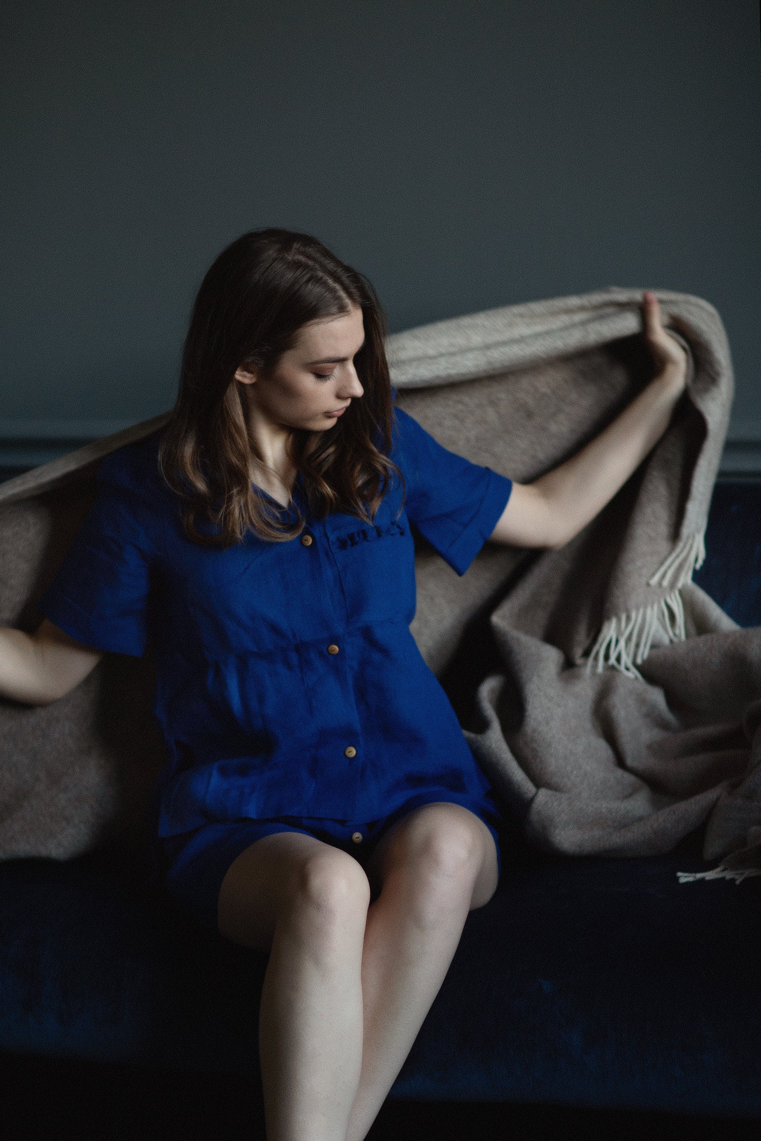 Elegant summer linen outfit for women, featuring ruffled linen top and loose high-waisted linen shorts